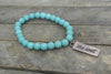 Turquoise beaded bracelet with Copper toned Be Still Charm
