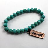 Turquoise beaded bracelet with Copper toned Be Still Charm